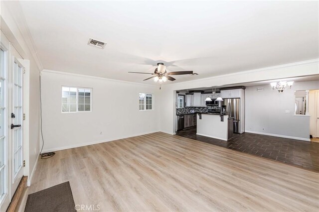 21323 Martin St, Carson, CA 90745 - unfurnished living room featuring a chandelier, crown molding, ceiling fan, wood finished floors, and baseboards