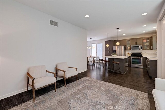 5515 Palm Dr, Hawthorne, CA 90250 - living area with dark wood-style flooring, recessed lighting, and baseboards