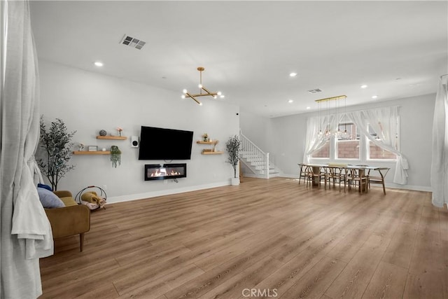 27010 Declaration Rd, Valencia, CA 91381 - living area with a chandelier, wood finished floors, stairway, recessed lighting, and baseboards