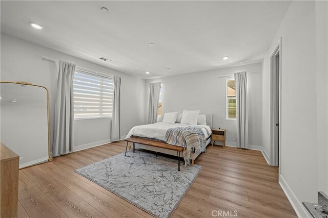 27010 Declaration Rd, Valencia, CA 91381 - bedroom with light wood finished floors, baseboards, and recessed lighting