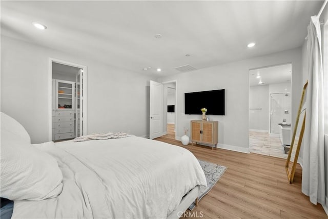 27010 Declaration Rd, Valencia, CA 91381 - bedroom with recessed lighting, light wood finished floors, baseboards, and a walk in closet