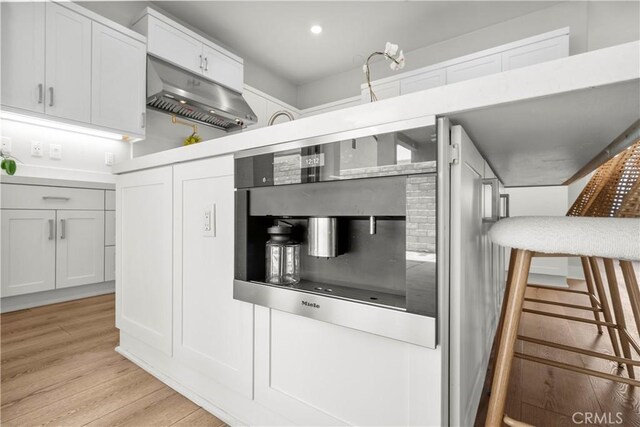 27010 Declaration Rd, Valencia, CA 91381 - kitchen featuring light wood finished floors, white cabinets, and recessed lighting