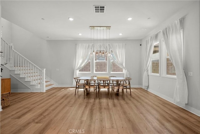27010 Declaration Rd, Valencia, CA 91381 - dining space with light wood-type flooring, stairway, baseboards, and recessed lighting