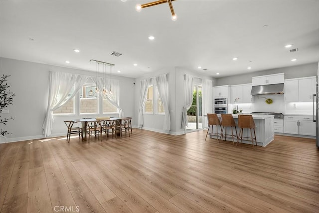 27010 Declaration Rd, Valencia, CA 91381 - dining area with light wood finished floors, recessed lighting, and baseboards