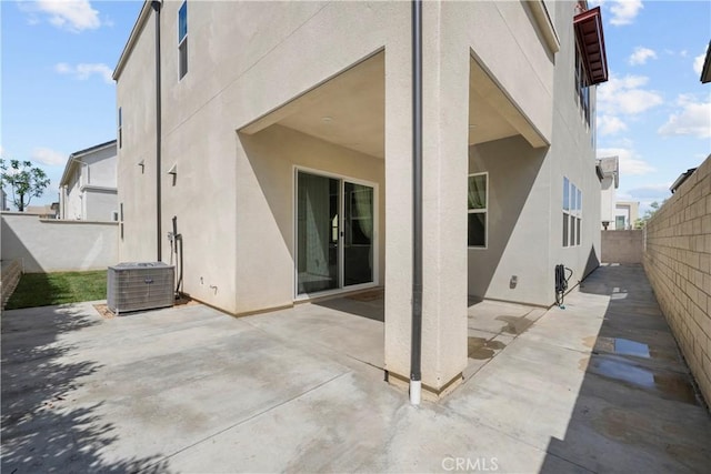 27010 Declaration Rd, Valencia, CA 91381 - rear view of house featuring stucco siding, cooling unit, a fenced backyard, and a patio area