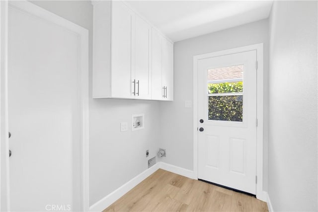 12151 Reagan St, Los Alamitos, CA 90720 - laundry room with washer hookup, light wood finished floors, hookup for an electric dryer, cabinet space, and baseboards