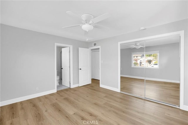 12151 Reagan St, Los Alamitos, CA 90720 - unfurnished bedroom featuring a closet, baseboards, wood finished floors, and a ceiling fan