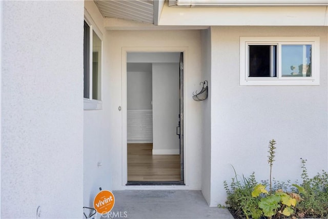 12151 Reagan St, Los Alamitos, CA 90720 - doorway to property featuring stucco siding