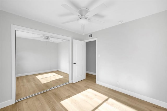 12151 Reagan St, Los Alamitos, CA 90720 - unfurnished bedroom with wood finished floors, baseboards, a closet, and a ceiling fan