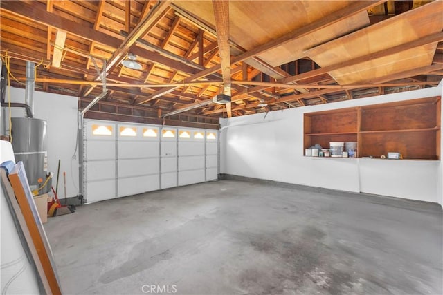 12151 Reagan St, Los Alamitos, CA 90720 - garage with gas water heater and a garage door opener