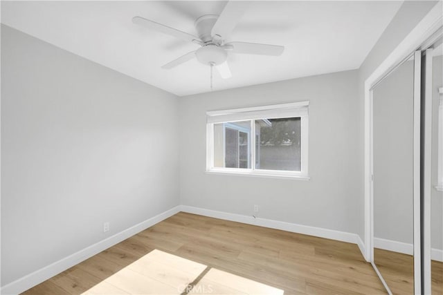 12151 Reagan St, Los Alamitos, CA 90720 - unfurnished bedroom with baseboards, a closet, light wood finished floors, and a ceiling fan