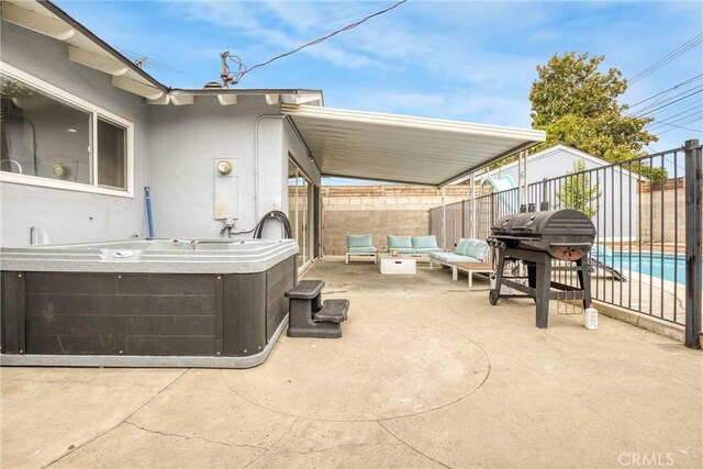1158 N Ivescrest Ave, Covina, CA 91724 - fenced backyard with a hot tub, a patio, outdoor lounge area, and area for grilling