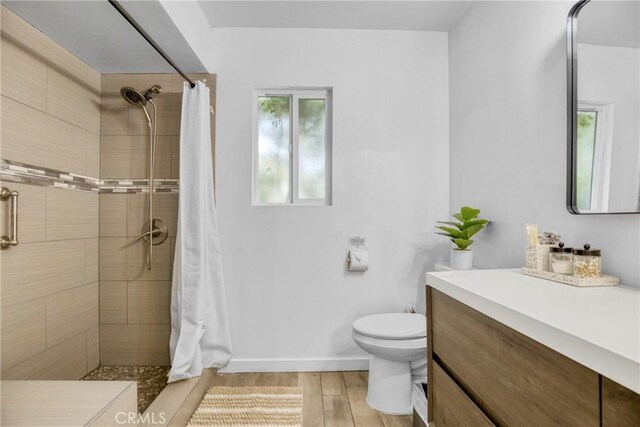 1158 N Ivescrest Ave, Covina, CA 91724 - bathroom with tiled shower, wood finished floors, and vanity