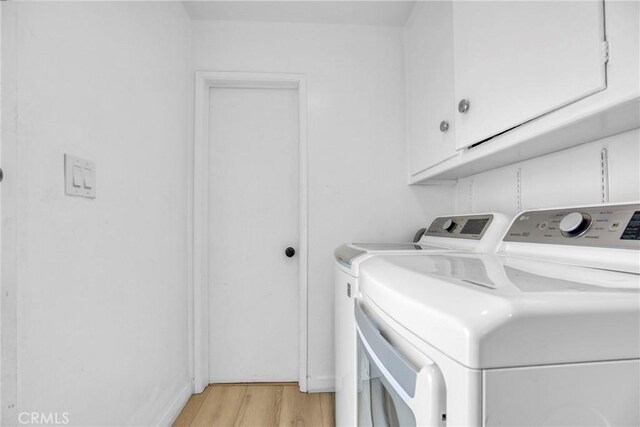 1158 N Ivescrest Ave, Covina, CA 91724 - washroom with washer and clothes dryer, light wood-style flooring, and cabinet space