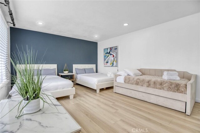1158 N Ivescrest Ave, Covina, CA 91724 - living room featuring light wood-type flooring and recessed lighting