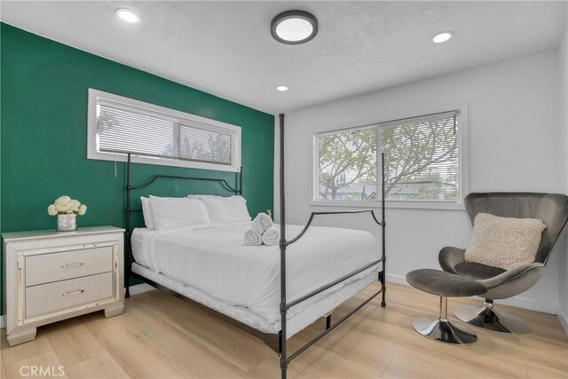 1158 N Ivescrest Ave, Covina, CA 91724 - bedroom with light wood finished floors and recessed lighting