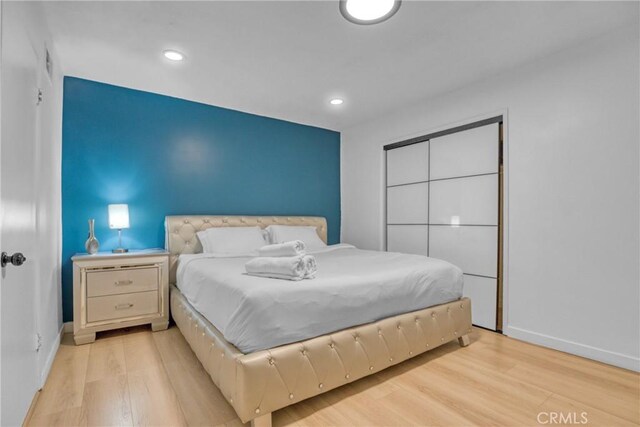 1158 N Ivescrest Ave, Covina, CA 91724 - bedroom featuring light wood-style flooring, recessed lighting, and a closet