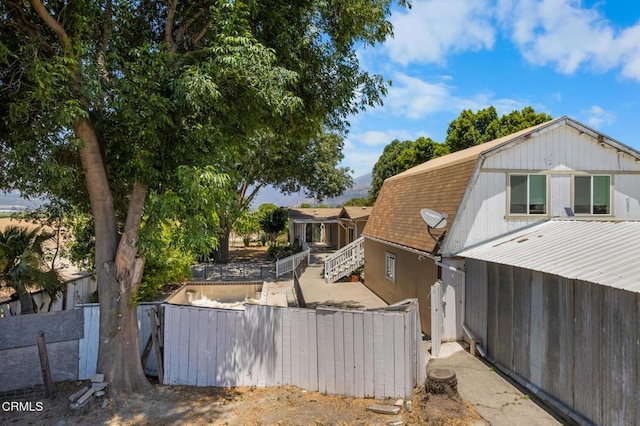 583 Ojai St, Fillmore, CA 93015 - view of property exterior with a gambrel roof and roof with shingles