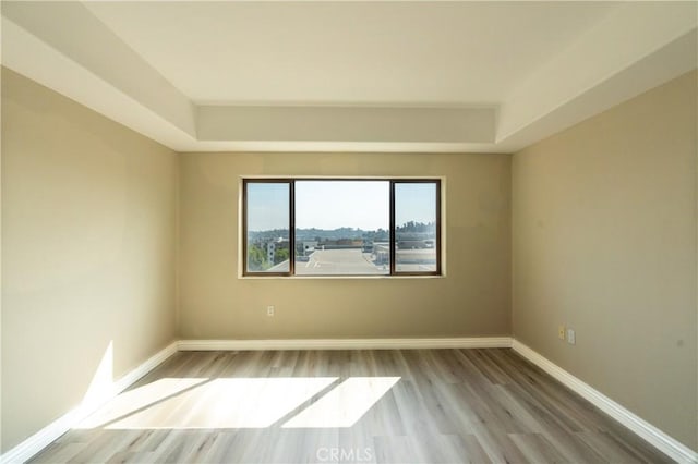 600 N Atlantic Blvd Unit 625, Monterey Park, CA 91754 - spare room featuring a tray ceiling, wood finished floors, and baseboards