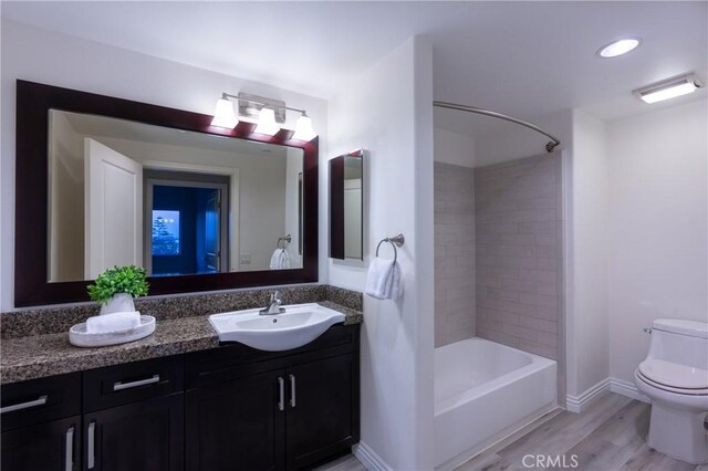 600 N Atlantic Blvd Unit 625, Monterey Park, CA 91754 - full bath featuring vanity, toilet, shower / tub combination, wood finished floors, and baseboards