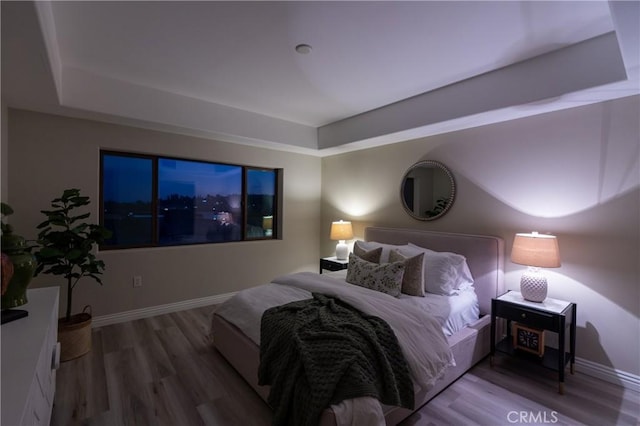 600 N Atlantic Blvd Unit 625, Monterey Park, CA 91754 - bedroom featuring a tray ceiling, wood finished floors, and baseboards