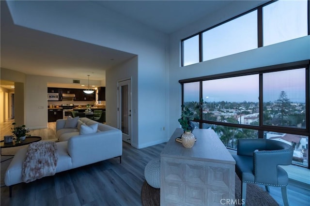 600 N Atlantic Blvd Unit 625, Monterey Park, CA 91754 - living room with wood finished floors, baseboards, and a towering ceiling