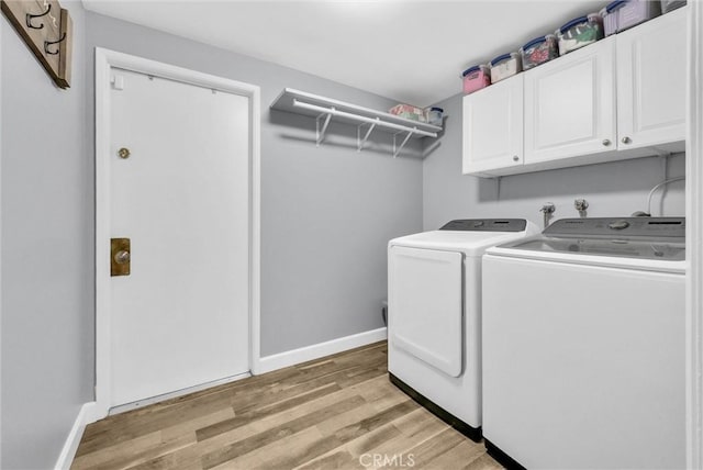 737 Cobb Ave, Placentia, CA 92870 - laundry area featuring washer and clothes dryer, cabinet space, light wood-type flooring, and baseboards