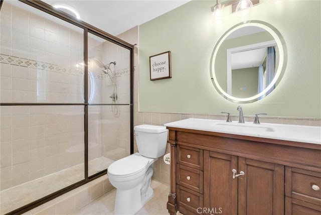 737 Cobb Ave, Placentia, CA 92870 - bathroom with toilet, vanity, tile walls, a shower stall, and tile patterned flooring
