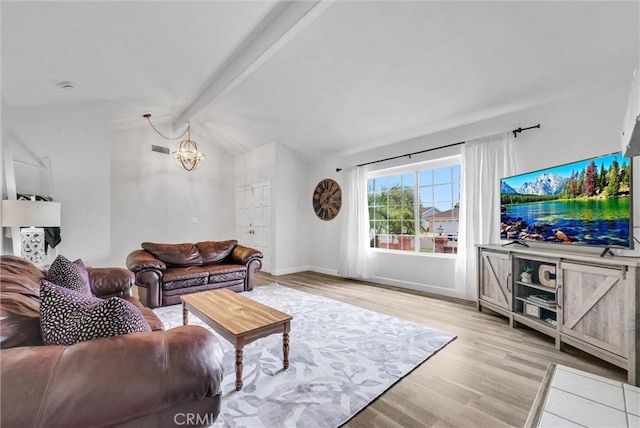 737 Cobb Ave, Placentia, CA 92870 - living room featuring a chandelier, light wood finished floors, and baseboards