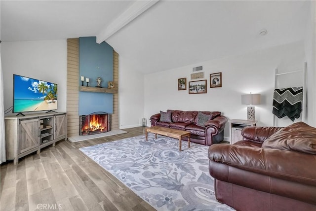 737 Cobb Ave, Placentia, CA 92870 - living room featuring wood finished floors, a brick fireplace, and baseboards