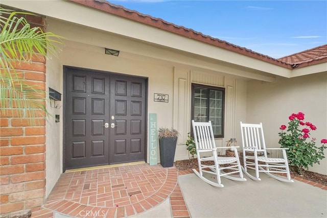 737 Cobb Ave, Placentia, CA 92870 - entrance to property with a porch, stucco siding, and a tile roof