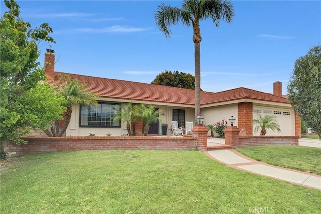737 Cobb Ave, Placentia, CA 92870 - single story home featuring an attached garage, a front yard, a chimney, brick siding, and a tile roof