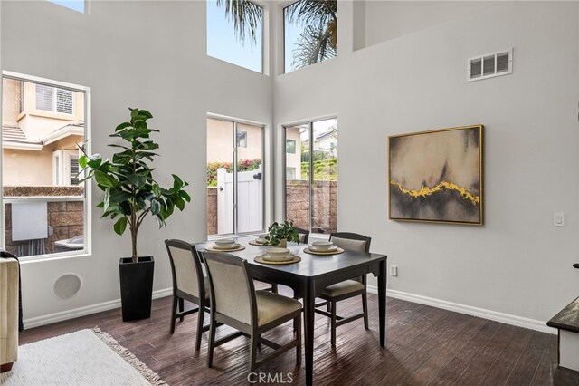 16209 Eagleridge Ct, La Mirada, CA 90638 - dining space with a high ceiling, dark wood finished floors, and baseboards