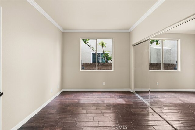 16209 Eagleridge Ct, La Mirada, CA 90638 - empty room featuring ornamental molding, dark wood-style flooring, and baseboards