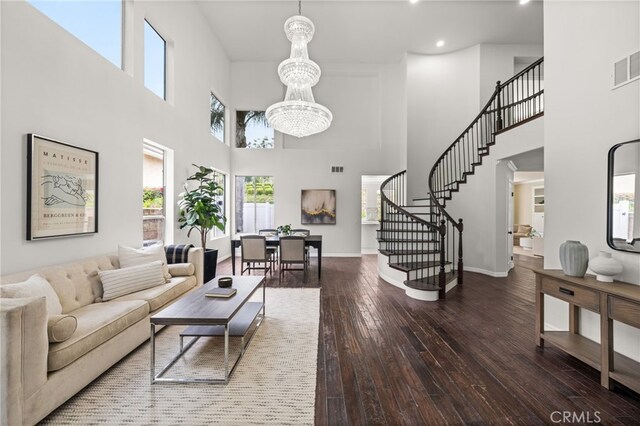 16209 Eagleridge Ct, La Mirada, CA 90638 - living area with a towering ceiling, a chandelier, stairs, hardwood / wood-style flooring, and recessed lighting