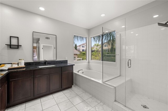 16209 Eagleridge Ct, La Mirada, CA 90638 - bathroom with vanity, a stall shower, a garden tub, tile patterned flooring, and recessed lighting