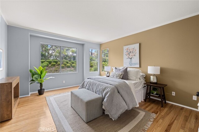 16209 Eagleridge Ct, La Mirada, CA 90638 - bedroom featuring crown molding, light wood finished floors, and baseboards