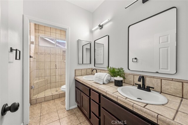 16209 Eagleridge Ct, La Mirada, CA 90638 - full bathroom with double vanity, a shower stall, toilet, and tile patterned flooring