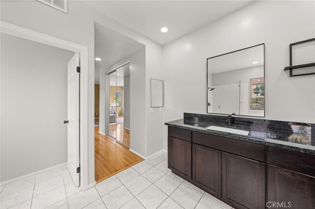 16209 Eagleridge Ct, La Mirada, CA 90638 - bathroom with vanity, baseboards, recessed lighting, and a shower