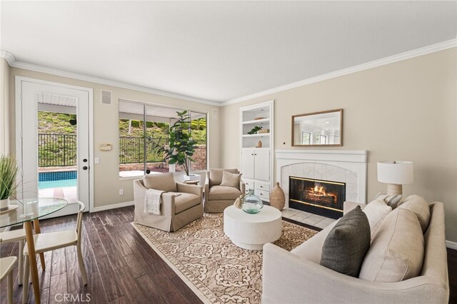 16209 Eagleridge Ct, La Mirada, CA 90638 - living room featuring dark wood-type flooring, ornamental molding, baseboards, and a fireplace