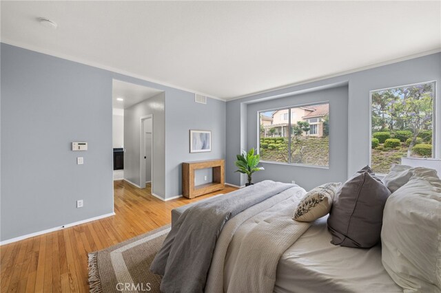 16209 Eagleridge Ct, La Mirada, CA 90638 - bedroom featuring baseboards, light wood-style flooring, ornamental molding, and recessed lighting