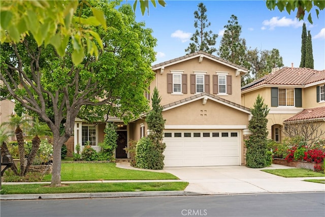 26 Middleton, Irvine, CA 92620 - view of front of house featuring an attached garage, driveway, stucco siding, a front yard, and a tile roof