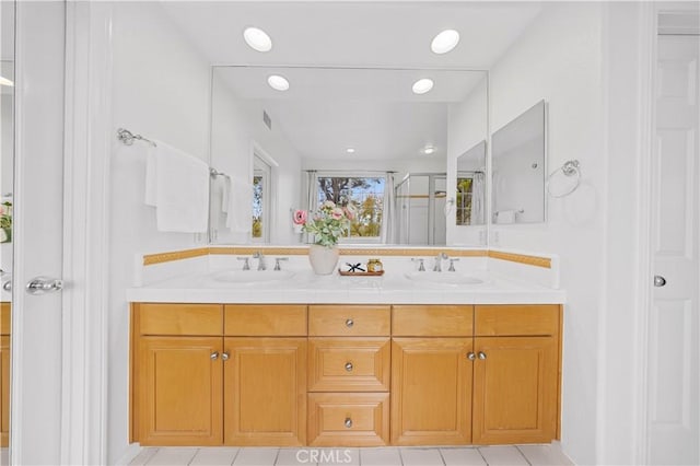 26 Middleton, Irvine, CA 92620 - bathroom with double vanity, a shower stall, tile patterned flooring, a closet, and recessed lighting