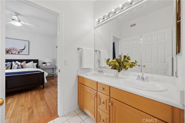 26 Middleton, Irvine, CA 92620 - full bathroom featuring double vanity, ceiling fan, and baseboards