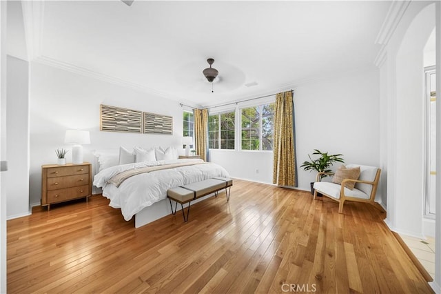 26 Middleton, Irvine, CA 92620 - bedroom with light wood-type flooring, crown molding, baseboards, a ceiling fan, and arched walkways