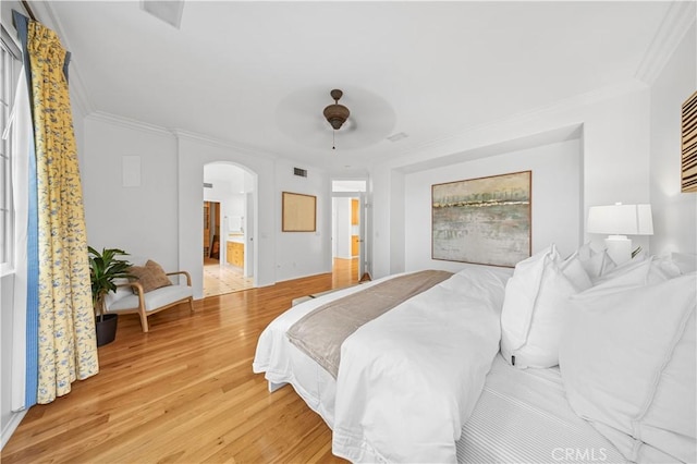 26 Middleton, Irvine, CA 92620 - bedroom with arched walkways, light wood-style flooring, ornamental molding, a ceiling fan, and connected bathroom