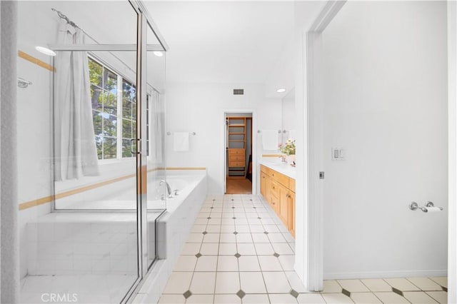 26 Middleton, Irvine, CA 92620 - full bathroom featuring vanity, a bath, a stall shower, and tile patterned floors