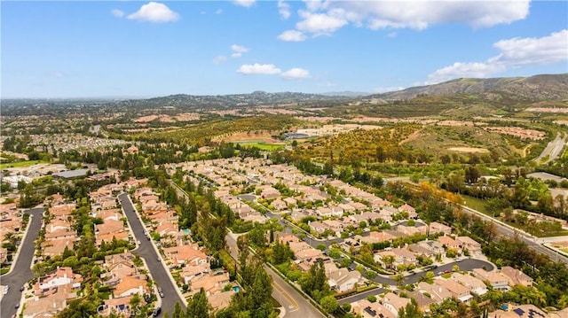 26 Middleton, Irvine, CA 92620 - aerial view of property and surrounding area with nearby suburban area and a mountainous background