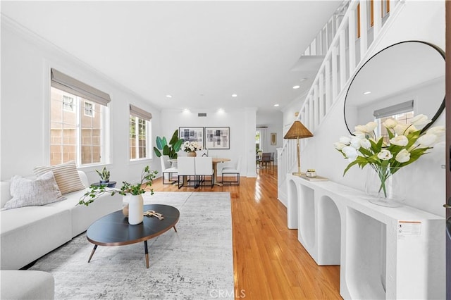 26 Middleton, Irvine, CA 92620 - living room featuring stairs, light wood-type flooring, recessed lighting, and ornamental molding