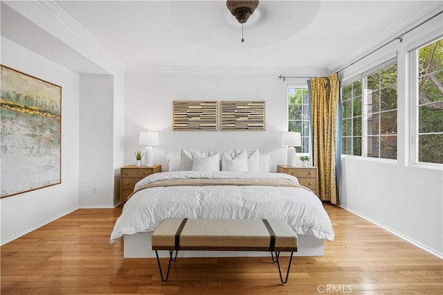 26 Middleton, Irvine, CA 92620 - bedroom with light wood-style flooring, multiple windows, crown molding, baseboards, and a ceiling fan